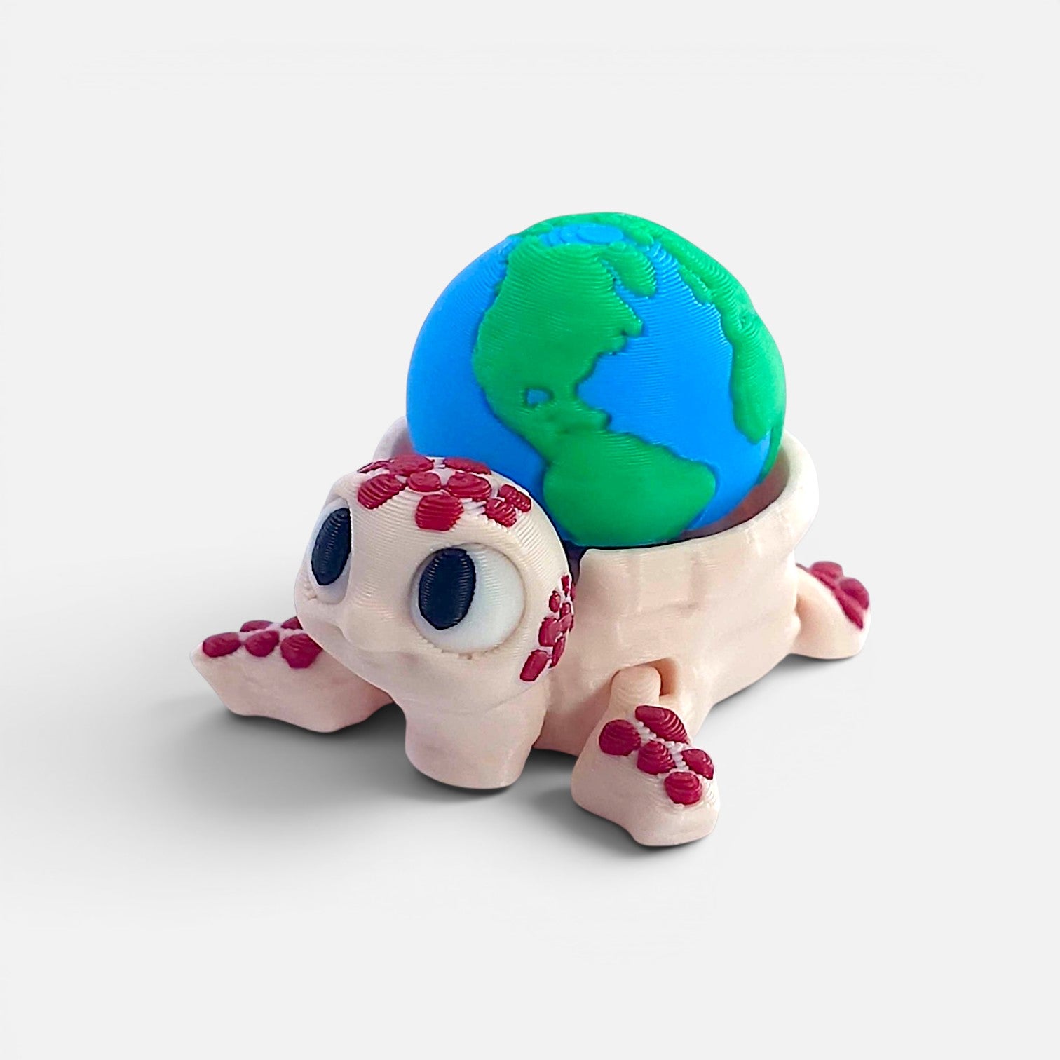 Turtle with the Earth on its back – a clicker toy