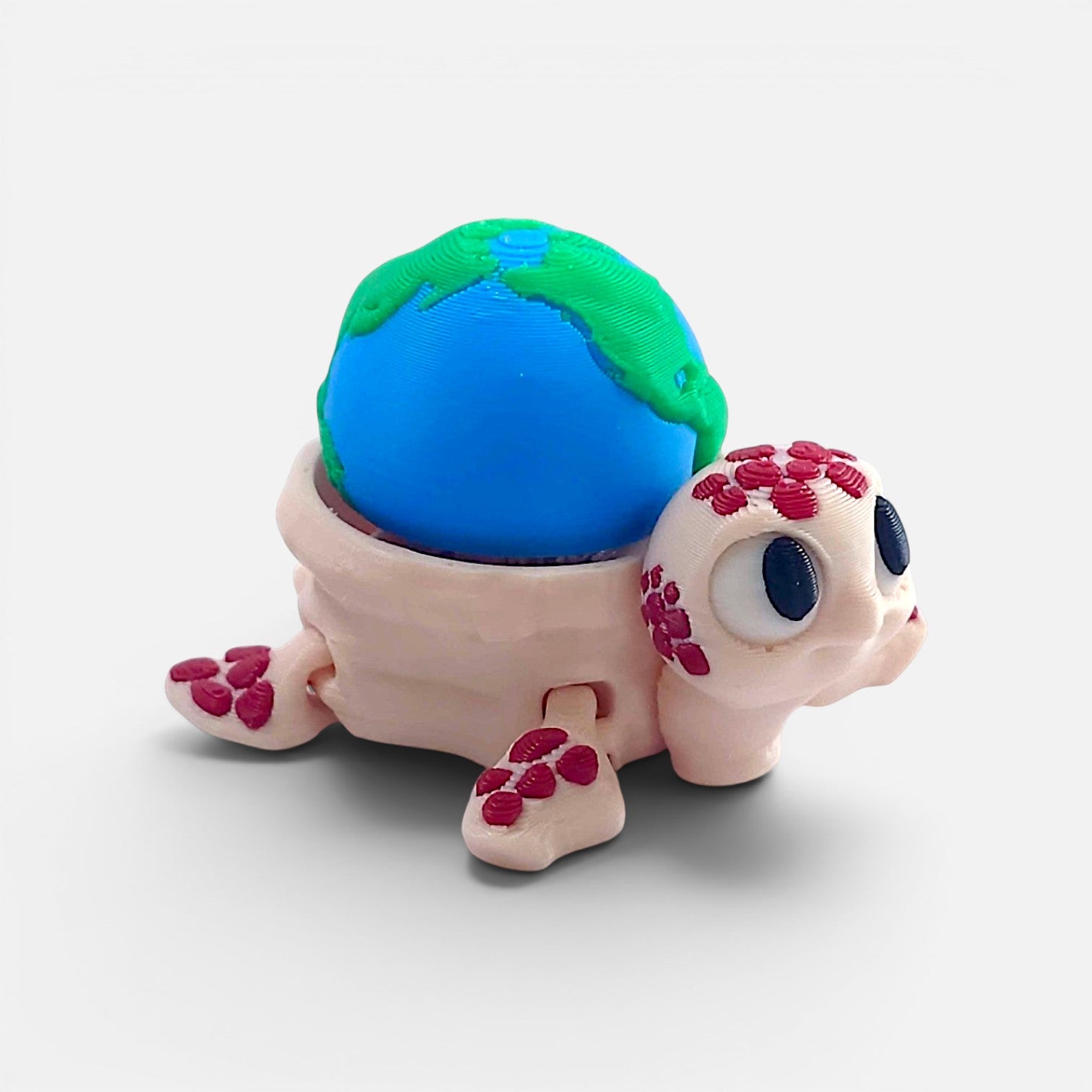 Turtle with the Earth on its back – a clicker toy
