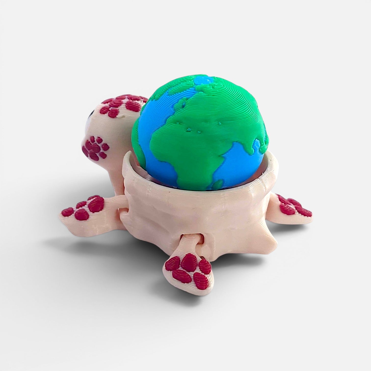 Turtle with the Earth on its back – a clicker toy