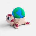 Turtle with the Earth on its back – a clicker toy