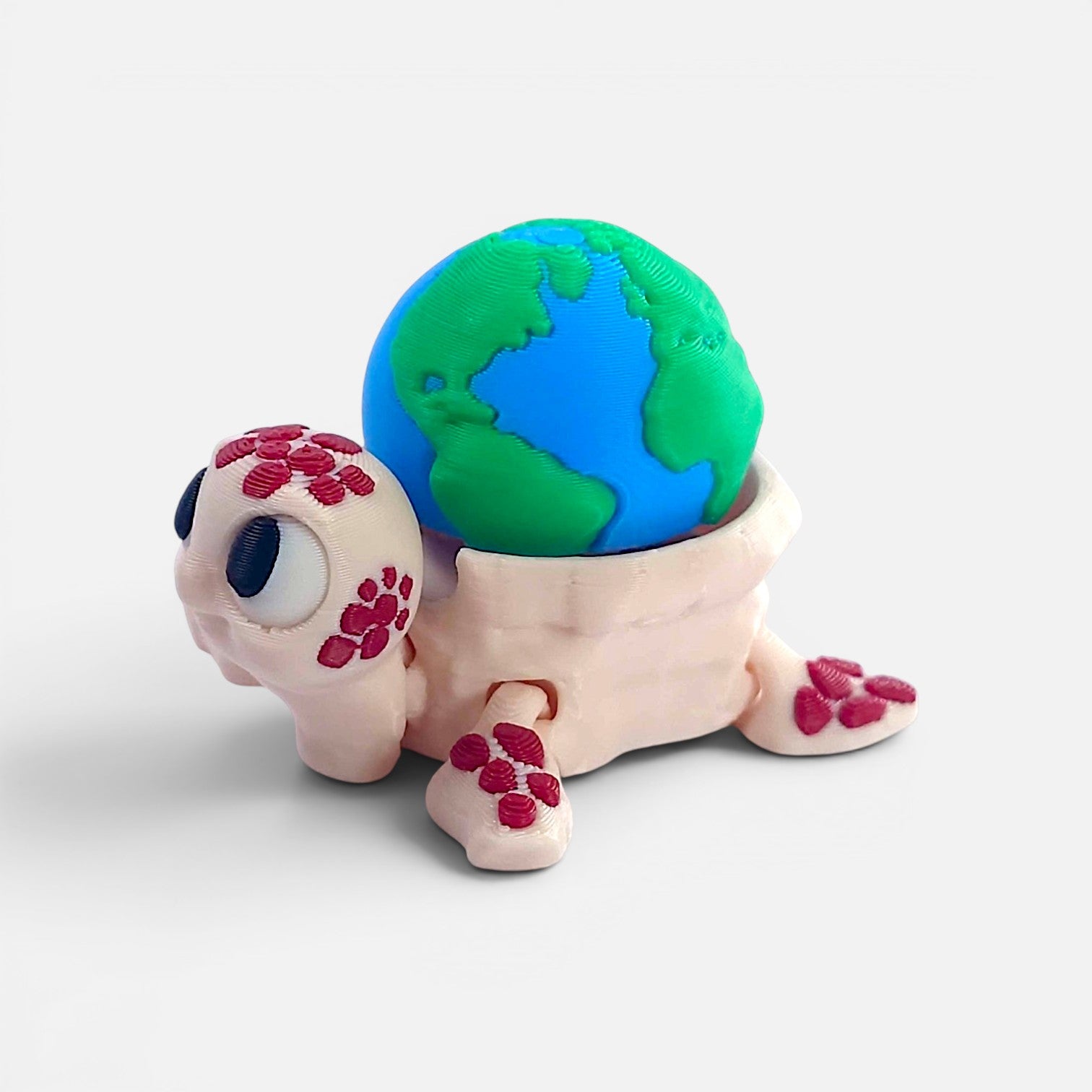 Turtle with the Earth on its back – a clicker toy