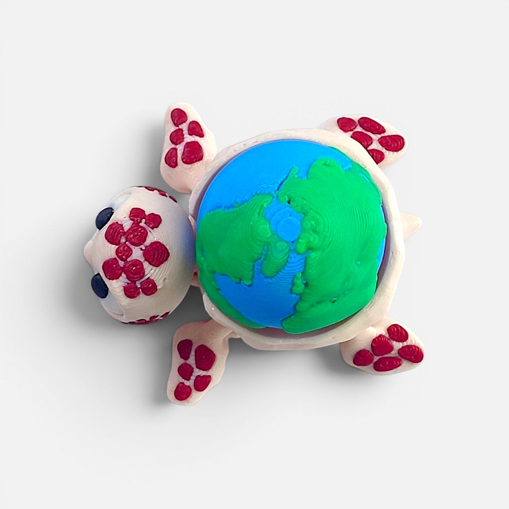 Turtle with the Earth on its back – a clicker toy