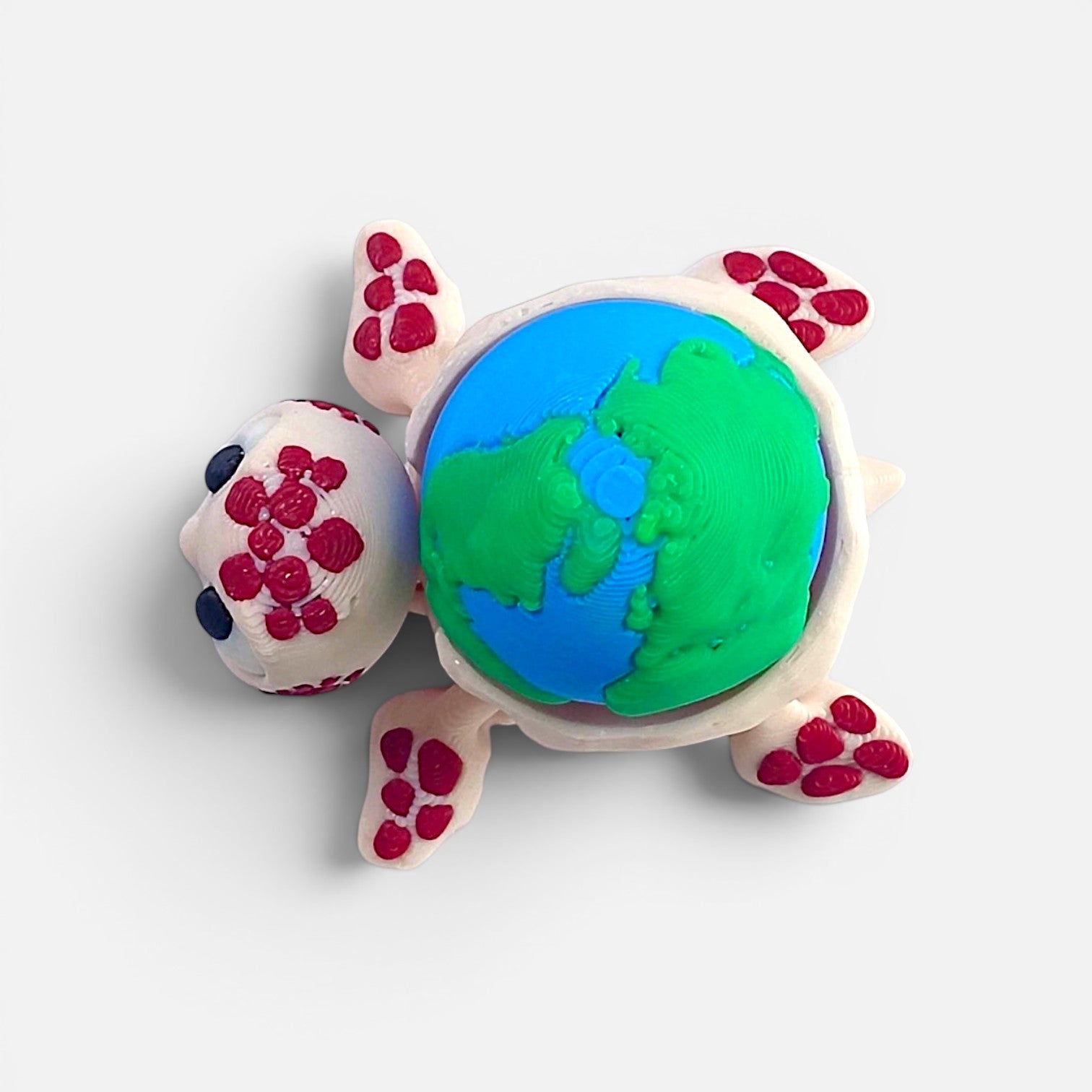 Turtle with the Earth on its back – a clicker toy