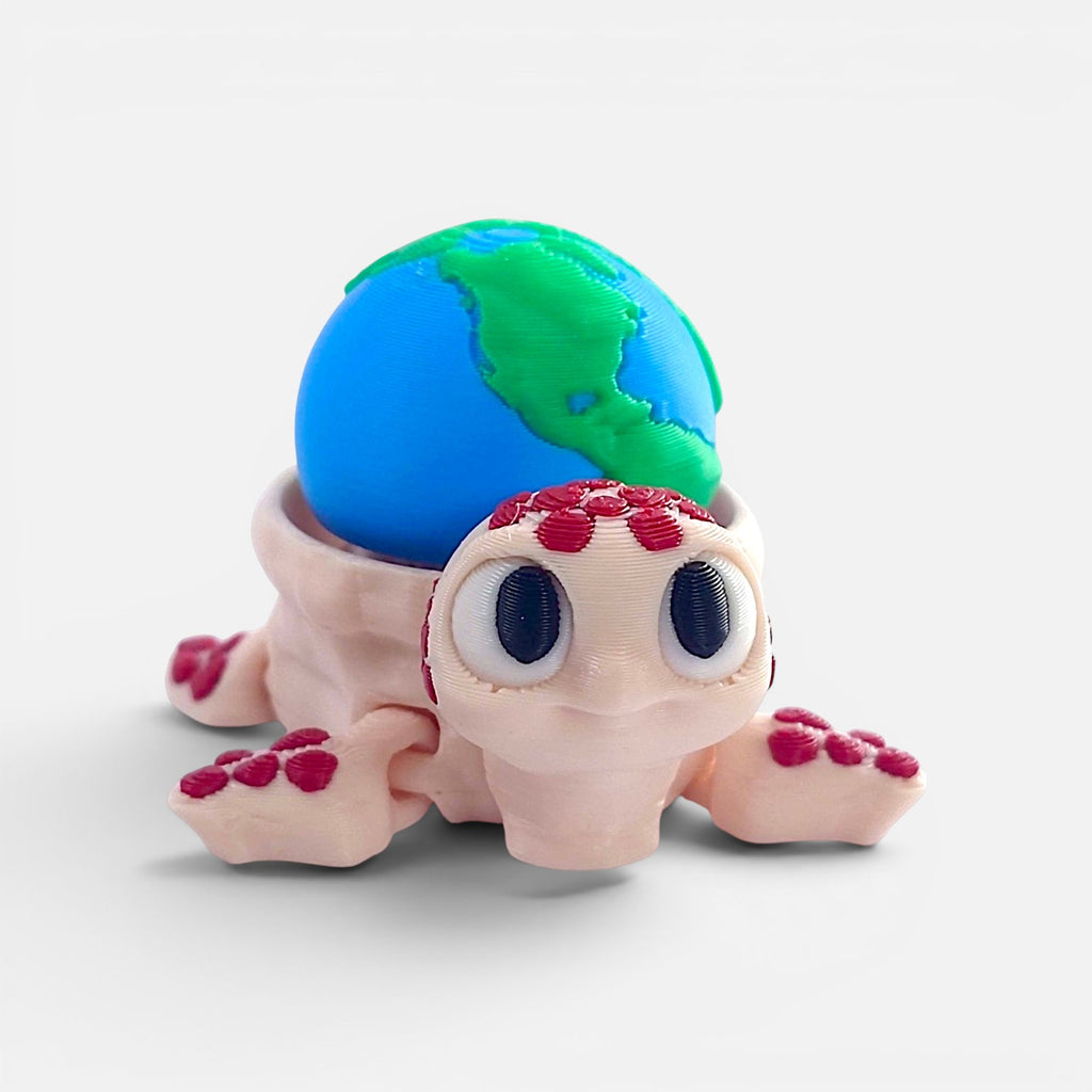 Turtle with the Earth on its back – a clicker toy